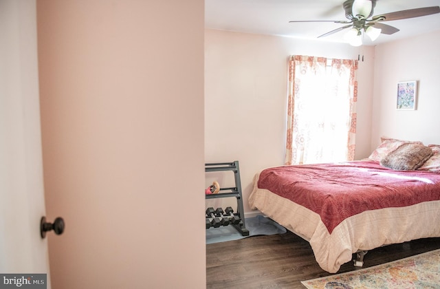 bedroom with ceiling fan and wood finished floors