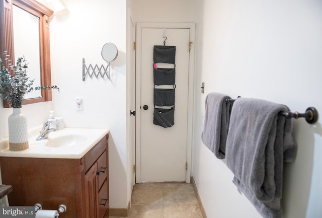 bathroom featuring vanity and baseboards