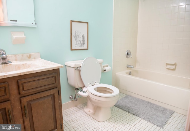 bathroom with tile patterned flooring, bathtub / shower combination, toilet, and vanity