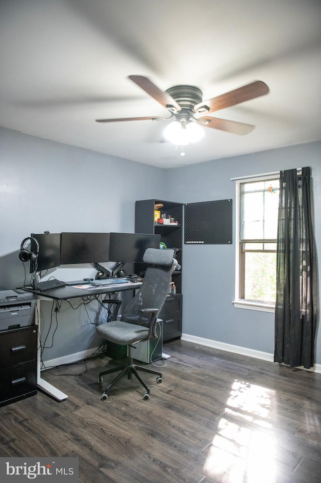 home office with baseboards, ceiling fan, and wood finished floors