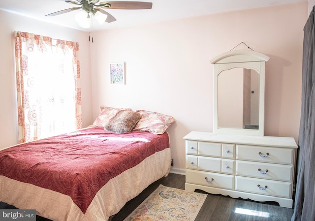 bedroom with ceiling fan and wood finished floors