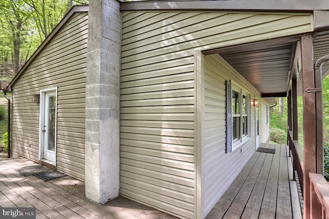 view of property exterior featuring a porch