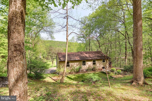 exterior space with a view of trees