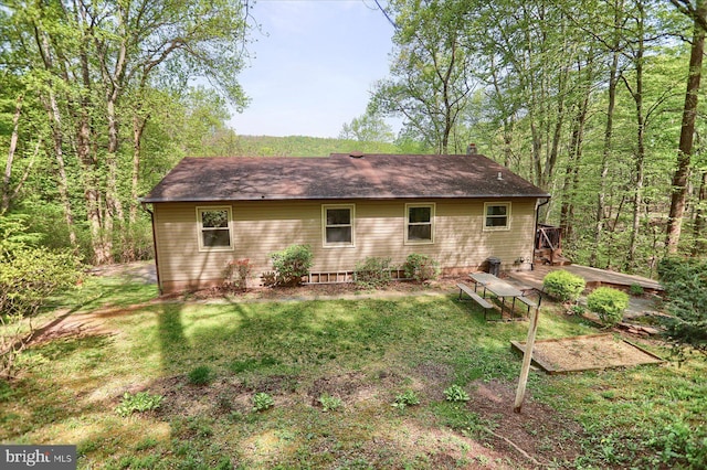back of house with a yard