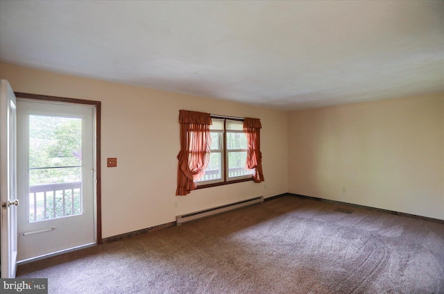 carpeted spare room featuring baseboards, a baseboard radiator, and a wealth of natural light