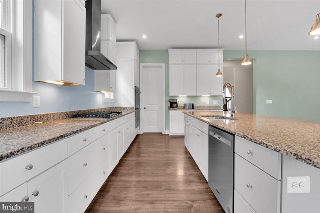 40918 White Clover Ln, Aldie, VA 20105 - kitchen featuring stainless steel appliances, a sink, wall chimney exhaust hood, light stone countertops, and dark wood-style flooring