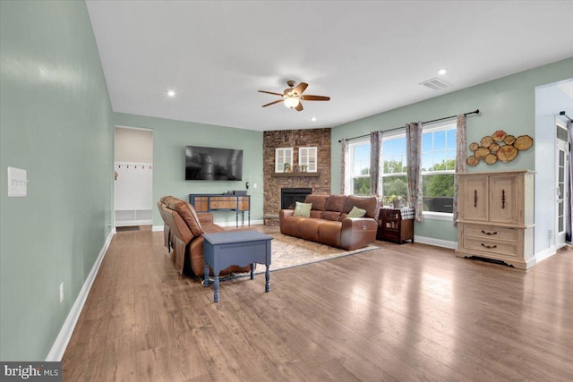 40918 White Clover Ln, Aldie, VA 20105 - living room featuring a ceiling fan, wood finished floors, baseboards, a fireplace, and recessed lighting
