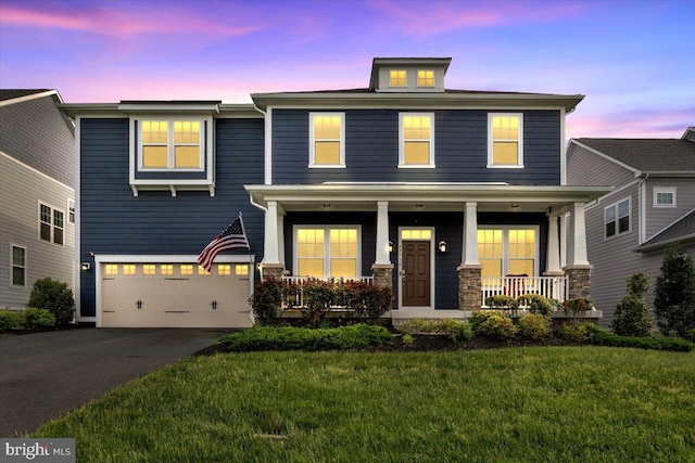 40918 White Clover Ln, Aldie, VA 20105 - view of front of property with covered porch, a garage, a front lawn, and asphalt driveway