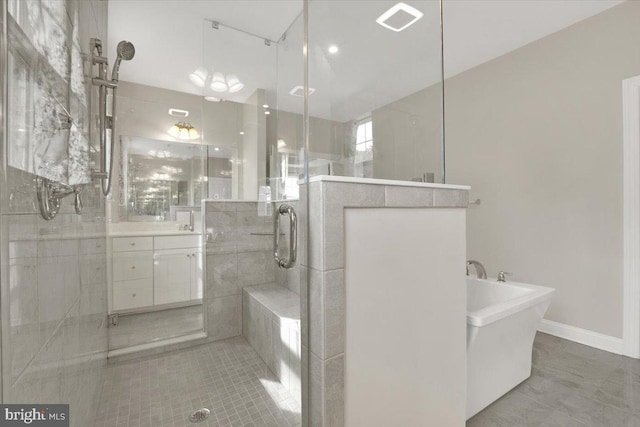 40918 White Clover Ln, Aldie, VA 20105 - full bathroom with a shower stall, vanity, a freestanding tub, and tile patterned flooring