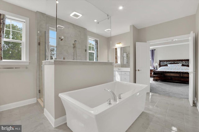 40918 White Clover Ln, Aldie, VA 20105 - bathroom with a stall shower, plenty of natural light, baseboards, and a bathtub