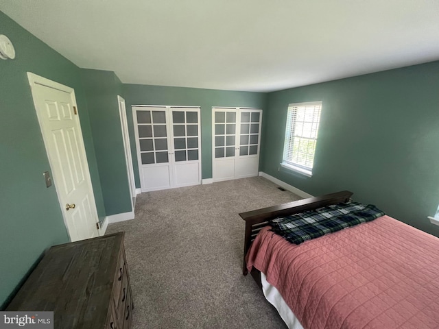 bedroom featuring carpet flooring and baseboards