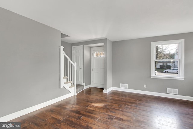 324 Woodbourne Ave, Baltimore, MD 21212 - empty room featuring dark wood finished floors and stairs