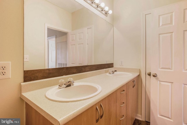 bathroom with double vanity and a sink