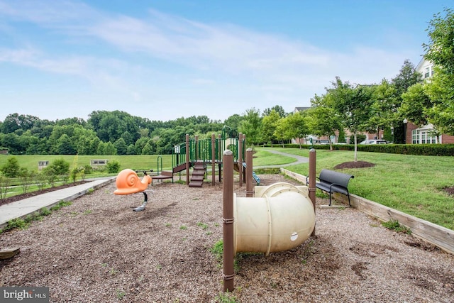 communal playground featuring a yard