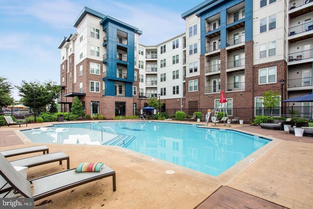 community pool featuring fence