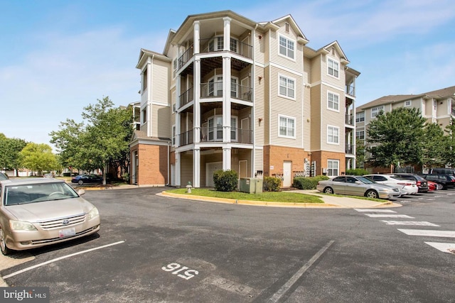 view of property featuring uncovered parking