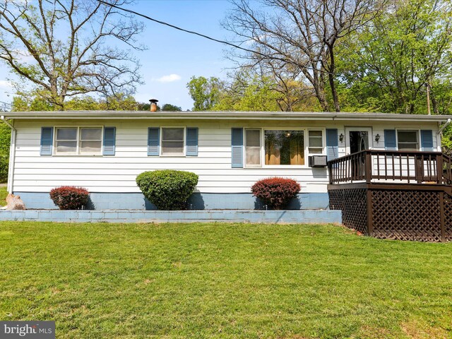 view of front of property featuring a wooden deck, cooling unit, a front lawn, and crawl space