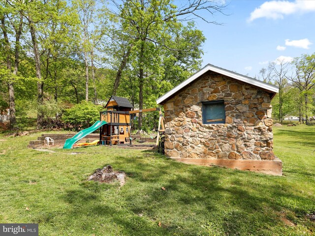 view of jungle gym with a lawn