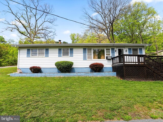 manufactured / mobile home with a wooden deck, stairs, a front lawn, and cooling unit