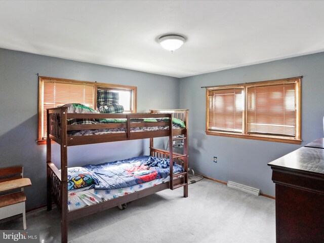 carpeted bedroom featuring visible vents
