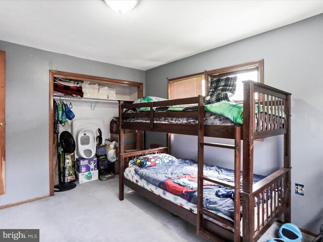 carpeted bedroom with a closet