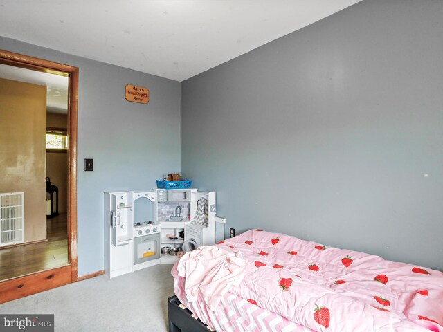 bedroom featuring carpet floors and visible vents