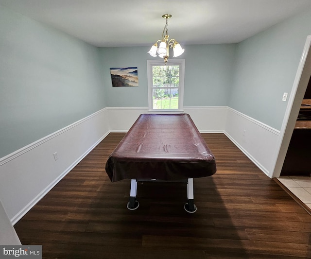 game room with a notable chandelier, wood finished floors, and pool table