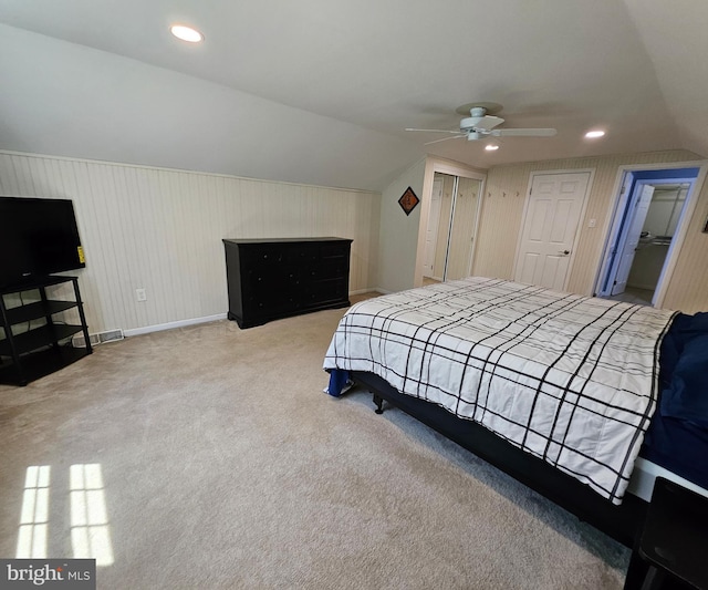 bedroom featuring carpet flooring, baseboards, vaulted ceiling, and visible vents