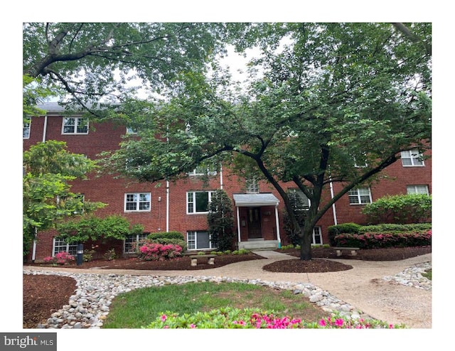 view of front of house featuring brick siding