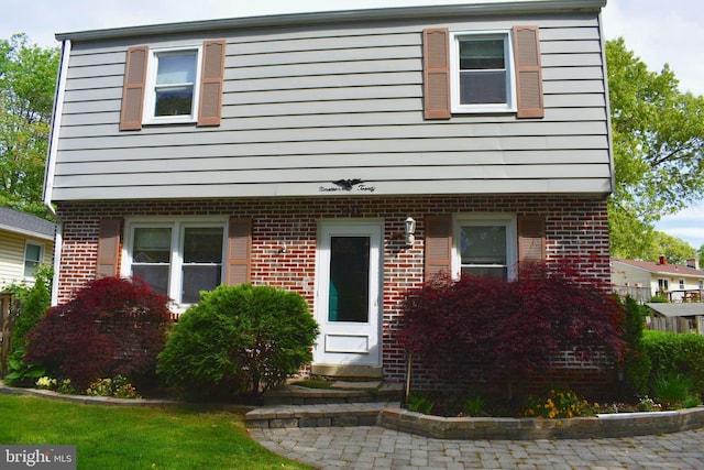 1920 Potomac Rd, Edgewater, MD 21037 - colonial house featuring brick siding and entry steps