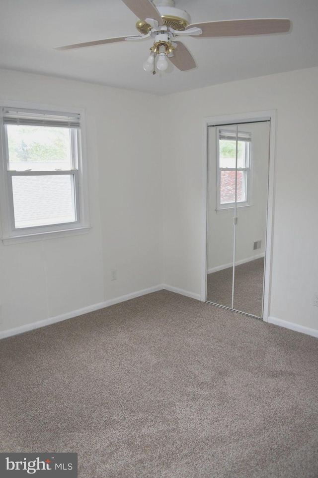 1920 Potomac Rd, Edgewater, MD 21037 - unfurnished bedroom featuring carpet flooring, baseboards, ceiling fan, and a closet