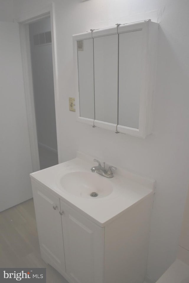 1920 Potomac Rd, Edgewater, MD 21037 - bathroom with visible vents, wood finished floors, and vanity