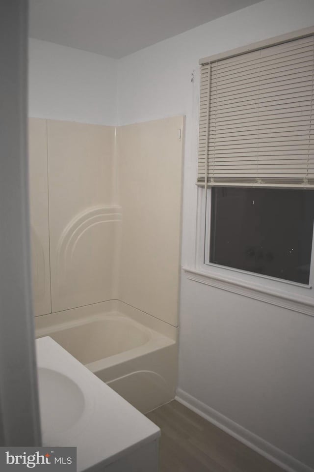 1920 Potomac Rd, Edgewater, MD 21037 - bathroom with toilet, baseboards, tub / shower combination, and wood finished floors