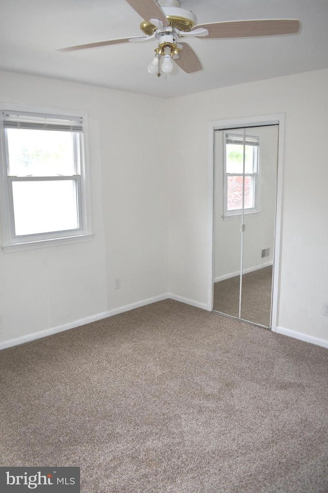 1920 Potomac Rd, Edgewater, MD 21037 - unfurnished bedroom with carpet floors, baseboards, visible vents, and a closet