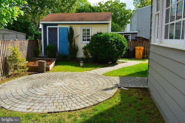 1920 Potomac Rd, Edgewater, MD 21037 - view of yard with fence, an outdoor structure, a storage shed, and a patio