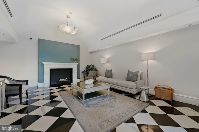 2600 Pennsylvania Ave NW Unit 601/6D, Washington, DC 20037 - living area with tile patterned floors, vaulted ceiling, baseboards, and a fireplace with flush hearth