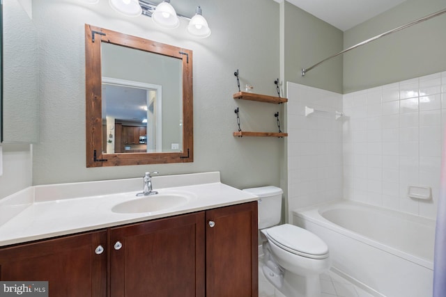 bathroom with vanity, tub / shower combination, and toilet