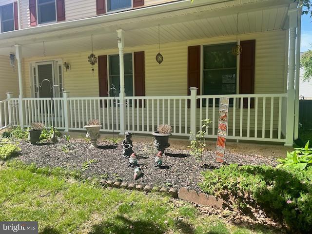 entrance to property with covered porch