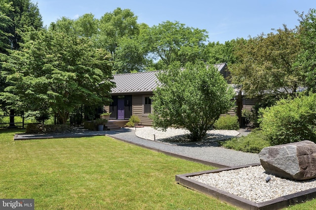 view of front of home featuring a standing seam roof and metal roof