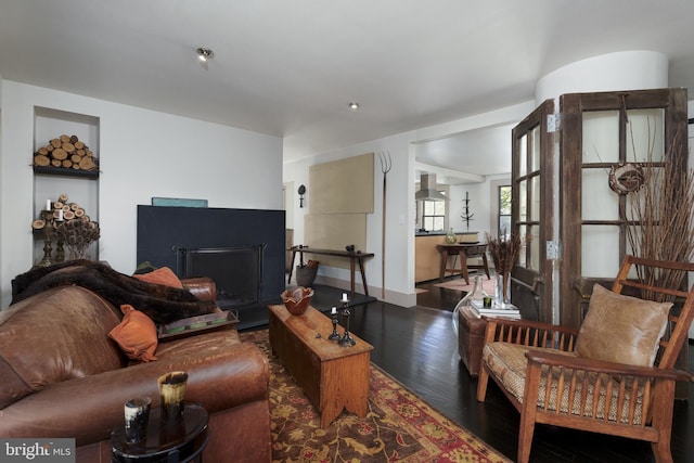 living area featuring wood finished floors and baseboards