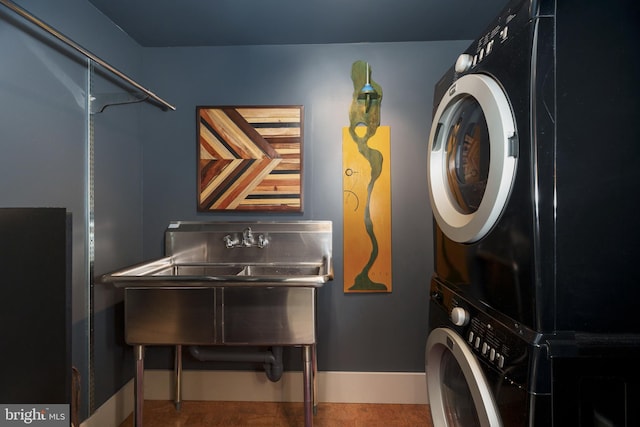 washroom with stacked washer / dryer
