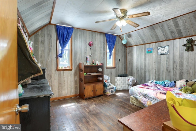 bedroom with wood walls, vaulted ceiling, baseboards, and hardwood / wood-style flooring