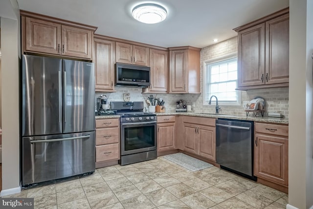 20 Aspen Dr, Pennsville, NJ 08070 - kitchen with a sink, backsplash, light stone countertops, and stainless steel appliances