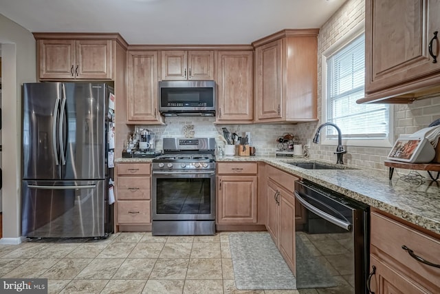 20 Aspen Dr, Pennsville, NJ 08070 - kitchen featuring a sink, decorative backsplash, light stone countertops, and stainless steel appliances