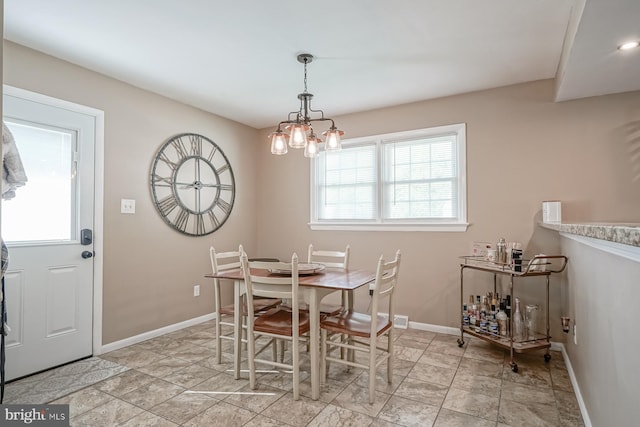 20 Aspen Dr, Pennsville, NJ 08070 - dining room with a healthy amount of sunlight, baseboards, and a chandelier