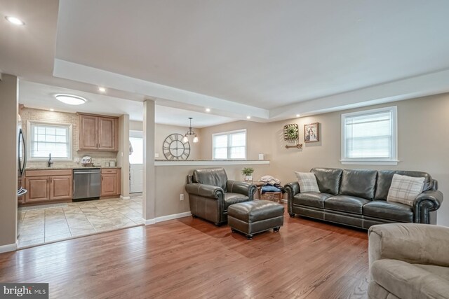 20 Aspen Dr, Pennsville, NJ 08070 - living room featuring recessed lighting, baseboards, light wood-style flooring, and a raised ceiling