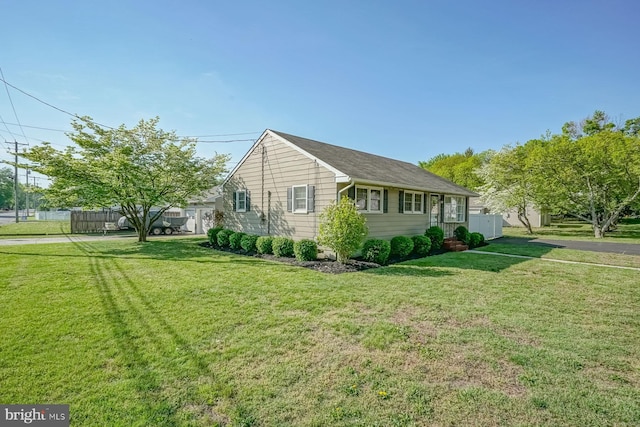 20 Aspen Dr, Pennsville, NJ 08070 - view of home's exterior featuring a lawn and fence