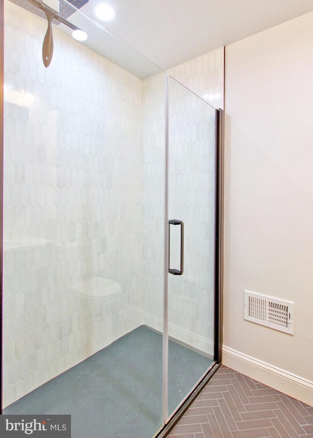 bathroom featuring recessed lighting, baseboards, visible vents, and a shower stall