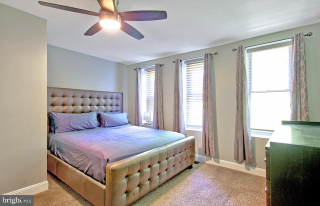 bedroom featuring baseboards, carpet flooring, and a ceiling fan