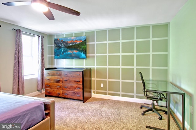 carpeted bedroom featuring baseboards